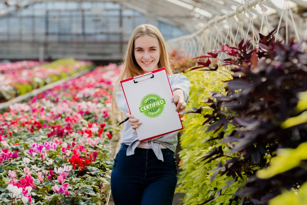 Front view woman Arborist showing Certificate